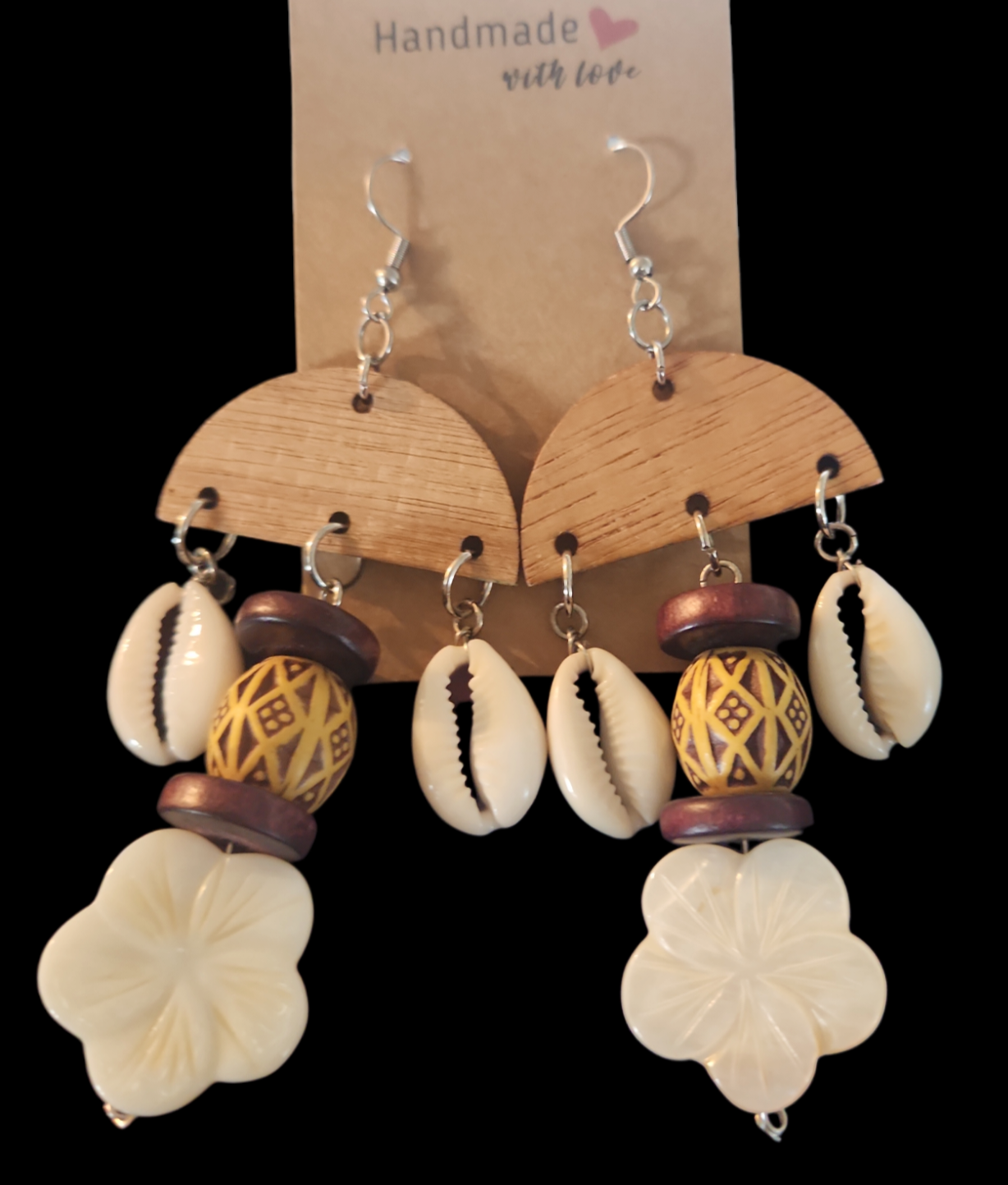 Cowrie shells, mother of pearl and coconut wood